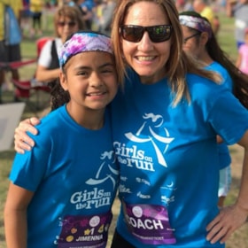 Smiling Girls on the Run coach and participant